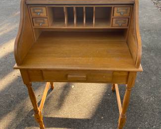 Small, vintage rolltop desk.