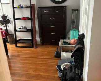 Bureau; mirror; travel gear; some sporting equipment