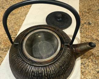 Very heavy teapot with strainer