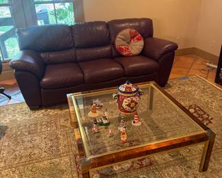 Leather is perfect on this comfortable sofa. Coffee table (metal and glass) is strikingly beautiful.