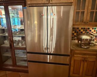 29 cubic foot Samsung refrigerator. Still under warranty. Less than one year old.