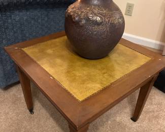 pair of vintage end tables with leather inserts on top
