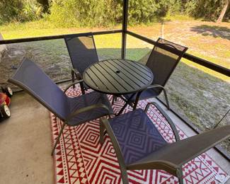 Outdoor Patio table with 4 chairs and outdoor rug