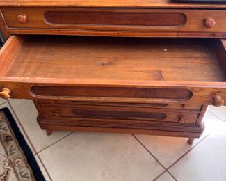 Antique spool cabinet drawer opened