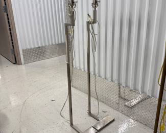 Two silver floor lamps