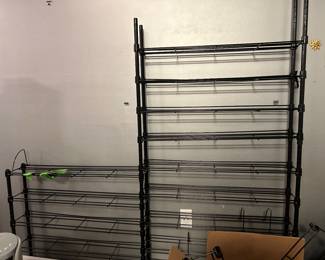 lots of racks and shelving of different sizes and types