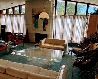 Harvey Guzzini style hand blown glass mushroom floor lamp; MCM lucite asymmetrical coffee table; MCM lucite magazine holder; Milo Baughman style sofa; Milo Baughman style loveseat; Milo Baughman style chrome upholstered chairs - pair
