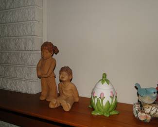 An egg, and children laughing decorative pieces