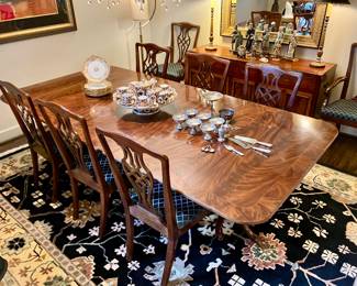 Banded flame mahogany dining table by E.J. Victor with 3 leaves.
Table measures 48” deep, 28.5” tall, and 76” long without leaves. Each leaf is 22” wide, so the maximum table length is 142”