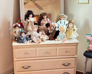 Dresser, mirror, and vintage dolls