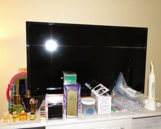 Small flat screen TV, and perfume items as well