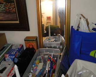 Mirror and a bucket of pens and pencils