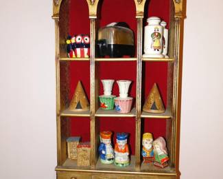 Salt and Pepper shakers, displayed nicely in a very unique curio