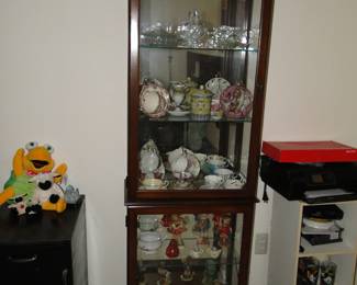 Solid wood, square curio cabinet with lots of great finds and treasures. The Estate travelled extensively.
