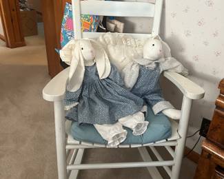 white rocker with handmade rabbits
