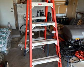like new werner ladder fiberglass twin ladder, can climb up both sides. T7406