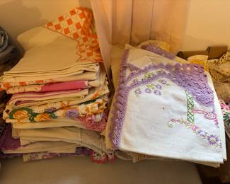 About 20’or more pair of embroidered crochet linen vintage pillow cases