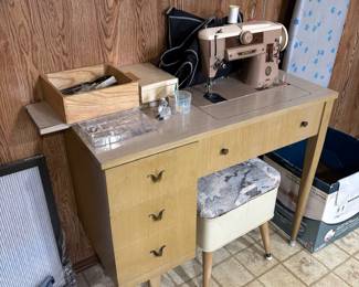 singer 401a sewing machine, has all kinds of attachments with it too.