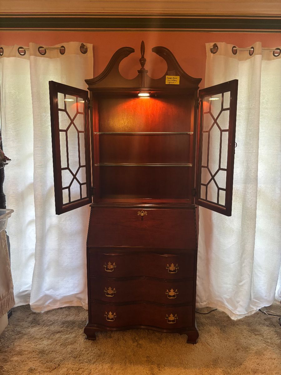 Jasper Cabinet Co. lighted with glass shelves and storage below.  Beautiful piece, big impact without taking up big space.  