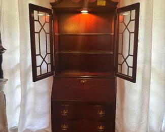 Jasper Cabinet Co. lighted with glass shelves and storage below. Beautiful piece, big impact without taking up big space.