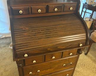 Rolltop desk, various sized drawers to organize your paper wares and supplies.