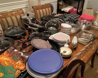 Large selection of pots, pans, bowls, and kitchenware.