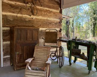 Porch of Pioneer Cabin: Antique Ice Box,  wheel chair