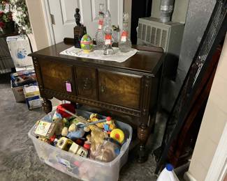 Server for Antique dining room suite. Vintage toys, decanters and bottles. Baby items.