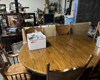 Solid 1980's claw foot table with 6 press back chairs with arm chair. Computer desk, computer monitor and keyboard, antique table, Empire dresser and chest of drawers, screen and glass door new in box, hand carved lions heads.