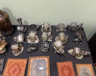 $62.50 Various silver plated figurine napkin rings priced individually