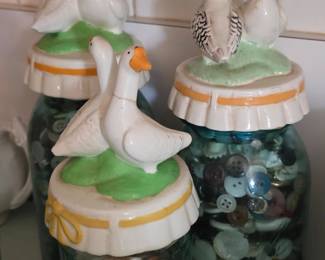 Mason jars with goose toppers, filled with buttons and shells