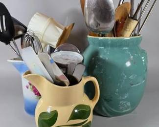 Stoneware pitchers and crock, full of kitchen utensils