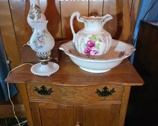 Antique oak washstand, milk glass lamps, pitcher and bowl