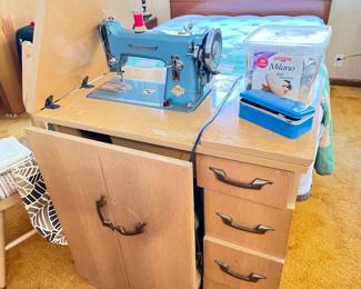 sewing machine in cabinet