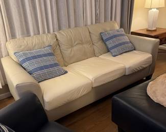 Leather couch  with navy blue swivel leather. Chairs 