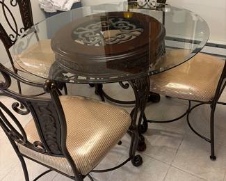 Glass  /metsl kitchen table and four matching chairs 