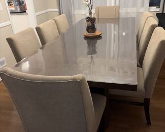 Dinning table and 8 chairs almost new 