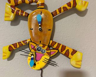 This Allen Design Co. Cat clock is on the wall in the sewing room. It's called "Dinner Time". Of course it's an orange tabby.