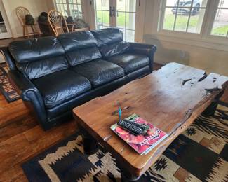 Leather Couch and wood coffee table, rugs