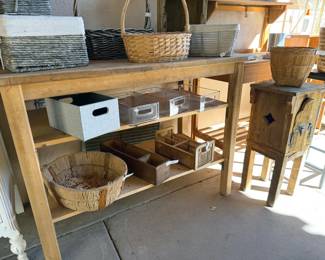 Wooden work table, assorted baskets + storage bins