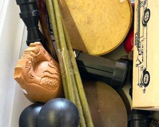 Assorted handheld musical instruments: tambourines, maracas, finger cymbals