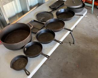 Full cast iron set complete with multiple size skillets Dutch oven cornbread flat skillet giant pot. All cast-iron will sell singles or all as a set.