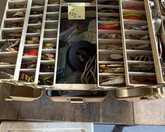 Box full of hand, painted fishing spoons lures
