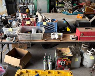 Propane tanks, oxygen tanks, toolboxes, few hand, tools, boxes of electrical supplies, plumbing supplies, automatic, water system for garden driveway, light set in the box torch set and a full set of Arlo security cameras with security camera main station complete with four security cameras