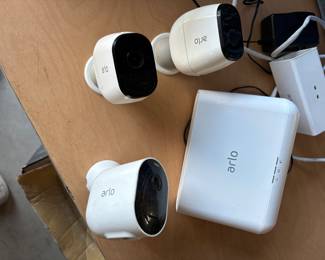 Arlo security system complete with 3 to 4 cameras and home station via Internet