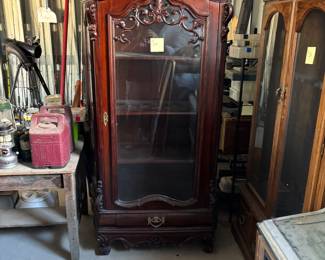 China cabinet, gun cabinet and the corner of the jukebox