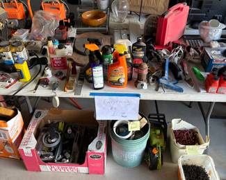 This is the dollar table everything on top of the table is one dollar there’s a bucket of tap, con screws, and drywall screws underneath the table along with the Ryobi chain Saw a new pump sprayer in the box