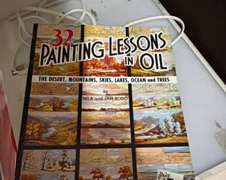 Art supplies books paints and easels