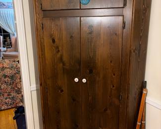 A pair of solid pine corner cabinets
