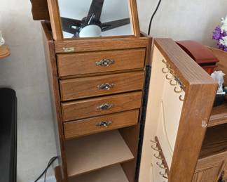 Vintage Wooden Jewelry Armoire with Mirror – Features multiple drawers, necklace hooks, swing-out side doors, and a lift-up mirror top, ideal for organizing and displaying your favorite pieces in classic style.